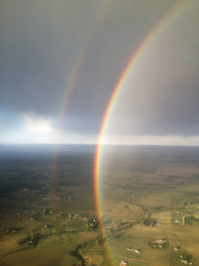 image of a double rainbow taken from a plane